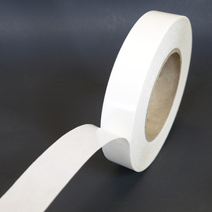 BT-246 roll of tape partially unwound to show adhesive and carrier