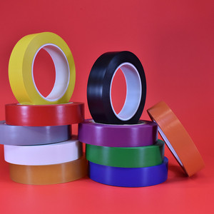 Vinyl safety marking tape in a variety of colors displayed in front of red background