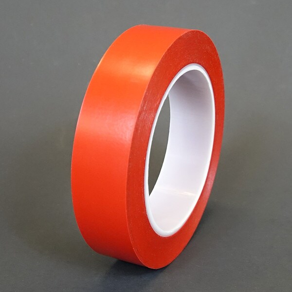 1 inch roll of red vinyl tape on plastic core