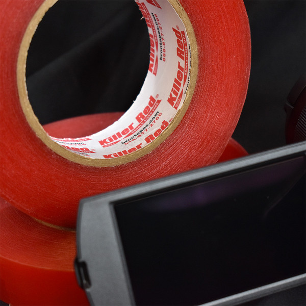Roll of Killer Red double sided tape shown with camera screen
