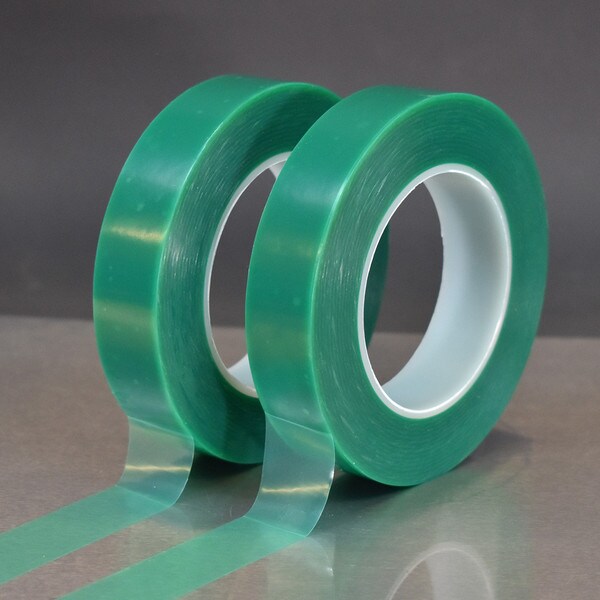 Two 1 inch rolls of BT-40025 green protective film applied to a sheet of metal