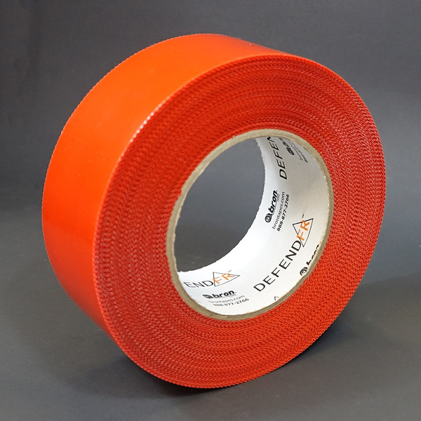 Roll of red pinked edge polyethylene tape