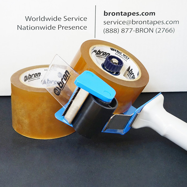 Rolls of carton sealing tape with blue tape dispenser