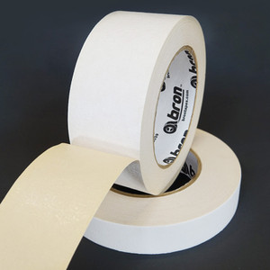 Roll of white golf grip tape slightly unwound to show adhesive