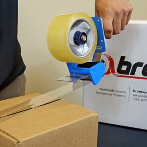 Using carton seal dispenser to seal a box