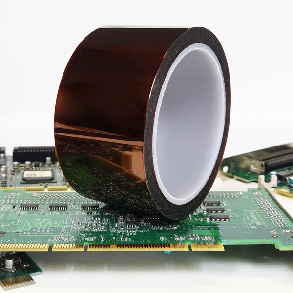 Roll of polyimide tape sitting on top of circuit board