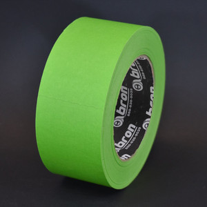 Roll of green marine gel coating tape in front of black background