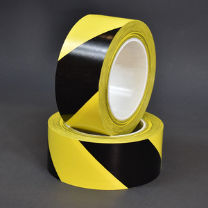 Two inch rolls of black and yellow hazard marking tape