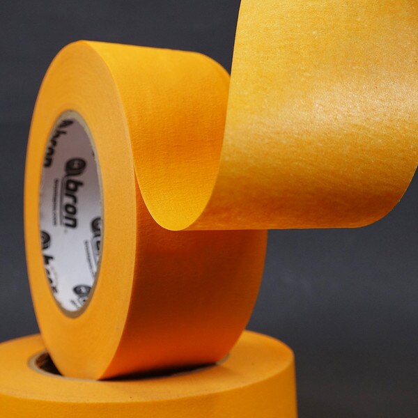 Roll of orange high temperature masking tape