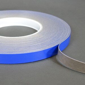 Roll of 1 inch 20 mil grey high bond unwound on blue liner