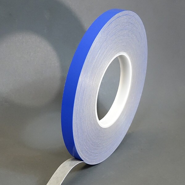 Roll of 1 inch 20 mil grey high bond slightly unwound