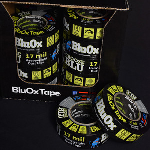 One roll of BluOx black duct tape tilted against another roll in custom shrink band